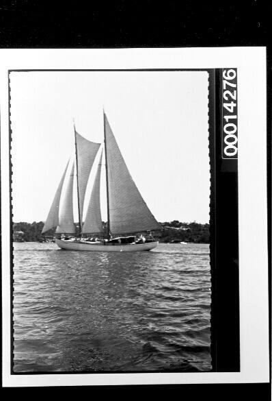 Broadside view of yacht under sail