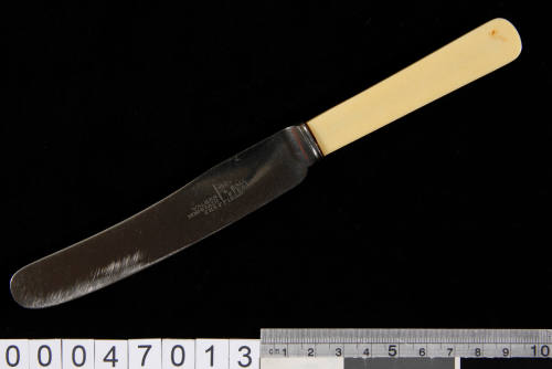 Knife with steel blade and yellow handle