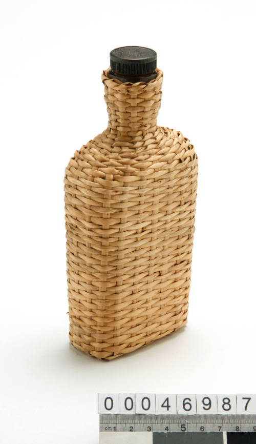 Glass bottle with wicker case