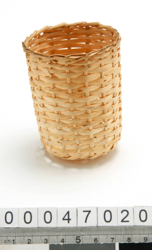 Wicker holder for drinking glass