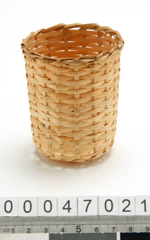 Wicker holder for drinking glass