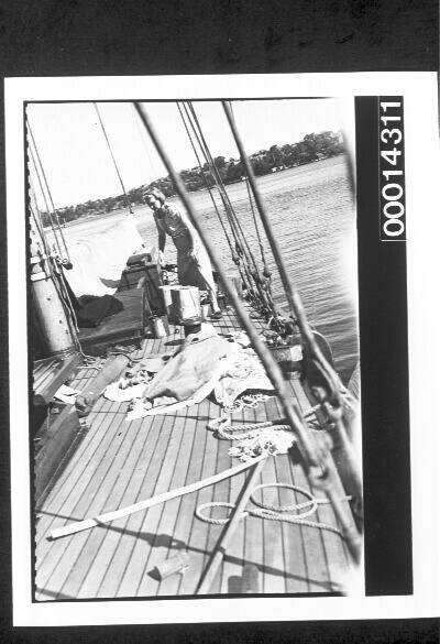 Woman working on the deck of a yacht