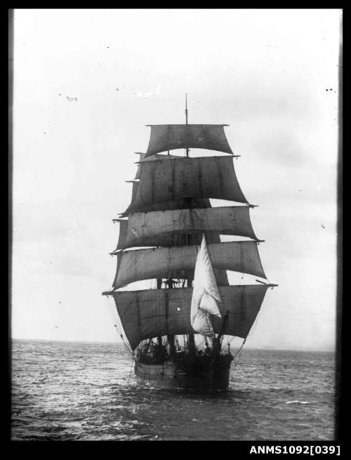 Three-masted barque with sails set and underway