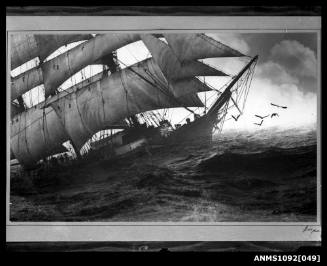 Bow of sailing ship at sea, with waves and sea birds