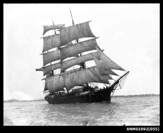 Three-masted barque with sails set and underway