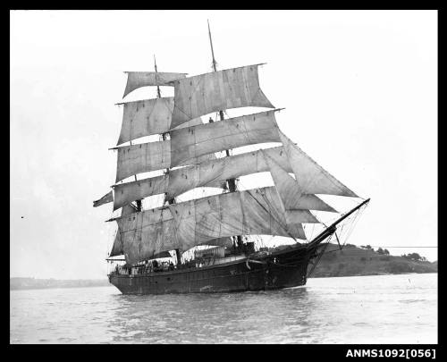 Three-masted barque with sails set and underway