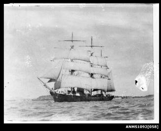 Three-masted barque with sails set and underway