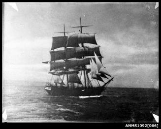 Three-masted barque with reduced sails