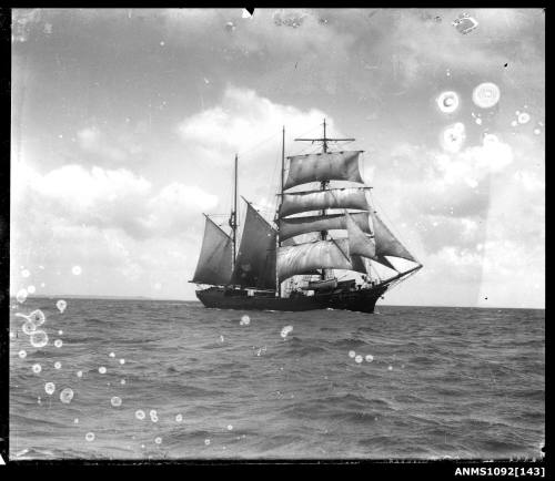 A three masted barquentine with sails set and underway