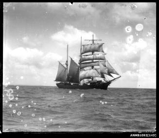 A three masted barquentine with sails set and underway