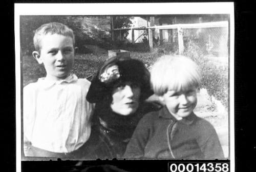 A women and two young boys