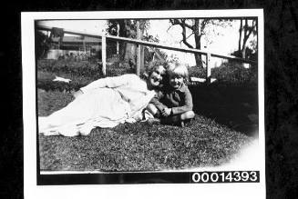 Woman and young boy on the grass