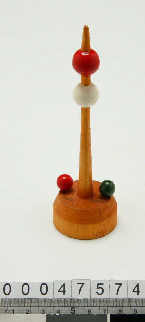 Wooden buoy with a red and white ball