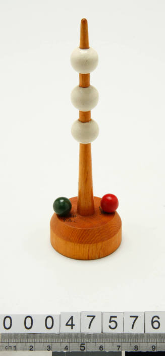 Wooden buoy with three white balls