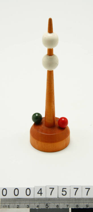 Wooden buoy with two white balls