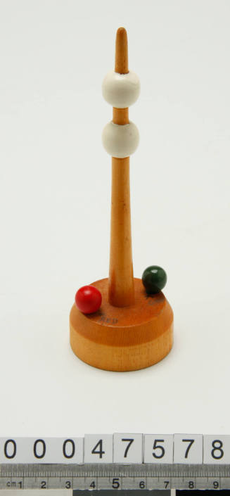 Wooden buoy with two white balls