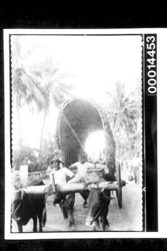 Oxen pulling a cart at Penang, Malaya