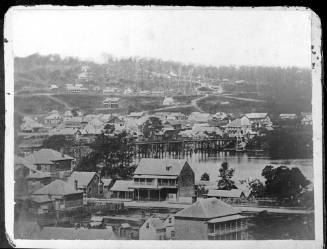 Black and white negative strip with two images of houses beside the flooded Brisbane River