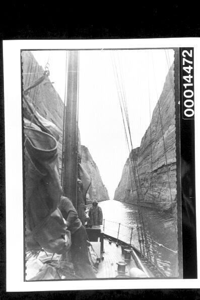 Yacht SIRIUS in a narrow canal, possibly the Corinth Canal, Greece