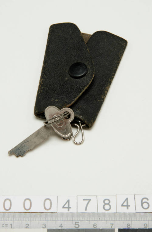 Key attached to leather key case