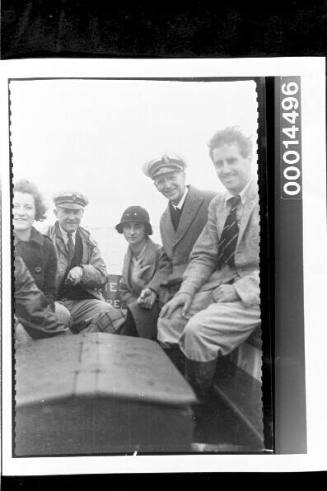 Harold Nossiter Snr among a group aboard a motor launch off the south coast of England