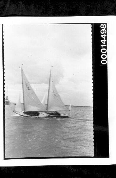 Two yachts listing to port side during a race off the south coast of England