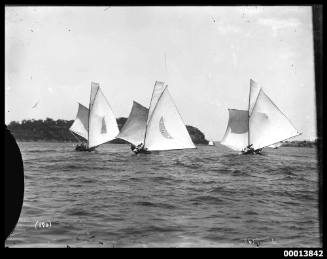 Early 18-footers YVONNE and AZTEC and one other sailing on Sydney Harbour