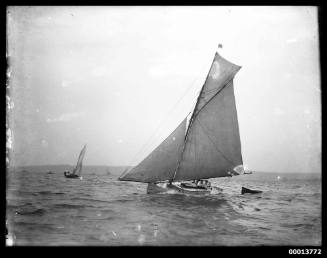 Portside view of a sloop towing a dinghy, Sydney Harbour