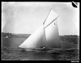 Gaff-rigged yacht with 2 on sail