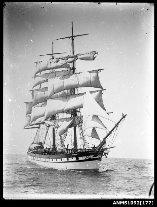 The image captures a three masted full rigged ship underway