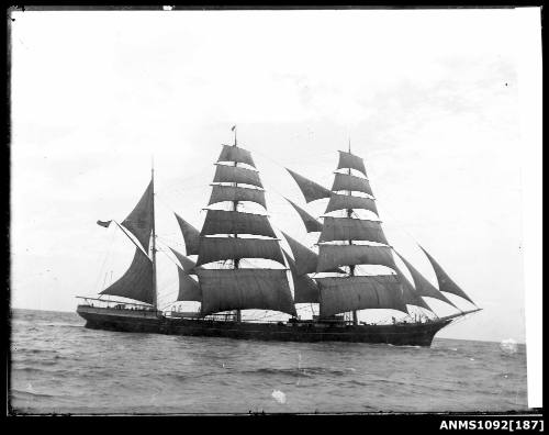 Negative capturing a three masted barque with sails set, underway from a starboard view