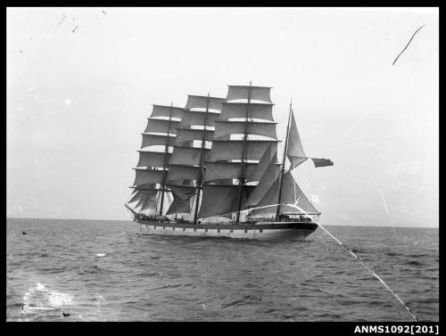 Negative captures a four masted barque with its sails set underway at a stern portside view