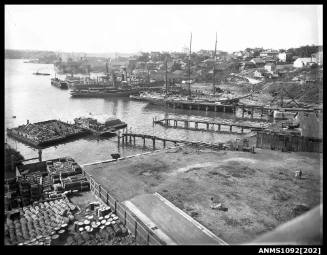 Morts Dock, Balmain, with the construction of Sydney Harbour Bridge in the background