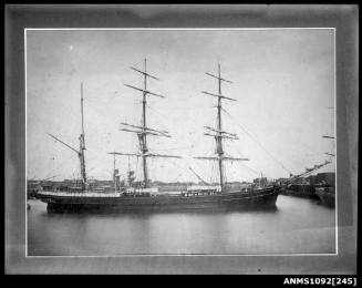 Image of a three masted barque at anchor