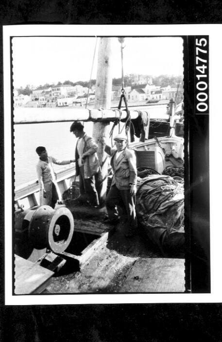 Fishermen aboard a vessel at Algeciras, Spain