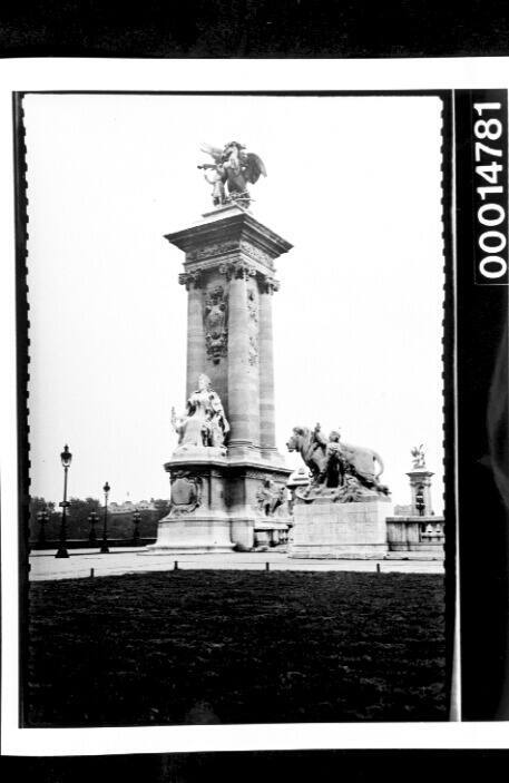 The Lion and Child statue at the entrance of the Pont Alexandre III in Paris, France