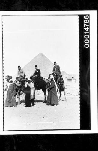 The Nossiters ride camels to visit the sphinx and pyramids of Egypt