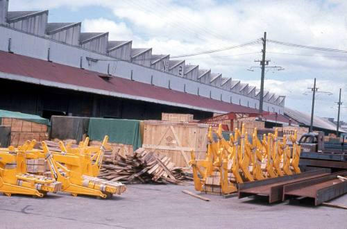 Slide depicting warehouses and equipment outside the stores