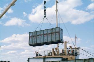 Slide depicting crain lifting a container off the ground