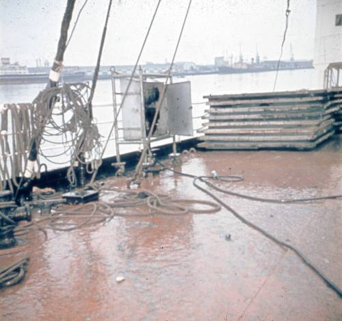 Slide depicting a wet deck of a vessel with electrical cords lying loose on the deck