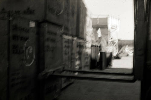 Slide depicting a forklift lifting double its height wooden crates