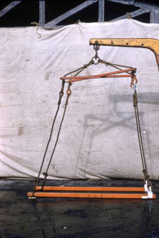 Slide depicting a forklift hoisting device