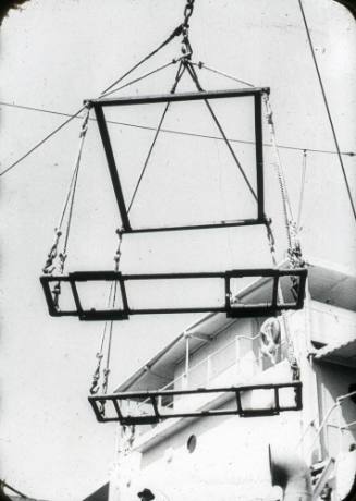 Slide depicting a forklift hoisting device in the air