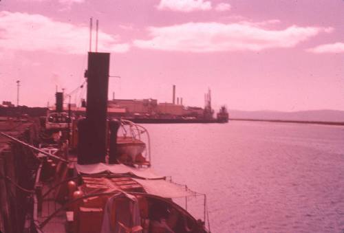 Slide depicting a vessel alongside the wharf