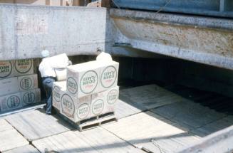 Slide depicting Kellogg’s Corn Flakes being loaded into the cargo area of a vessel