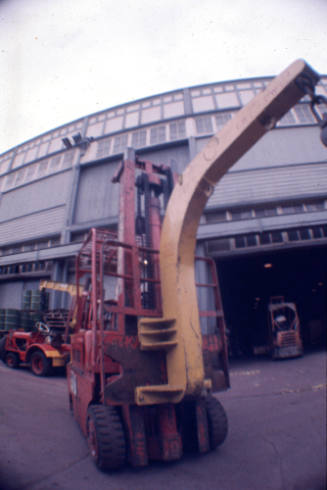 Slide depicting a forklift at the front of wharf building