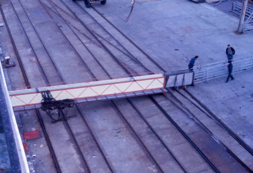 Slide depicting a raised platform that the sheep will run along to be loaded on a vessel