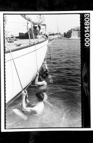 Midshipmen of HMAS AUSTRALIA cleaning the hull of the yacht SIRIUS at Malta