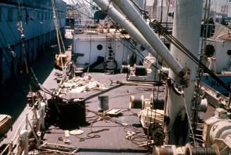 Slide depicting the deck of a ship with uncoiled ropes