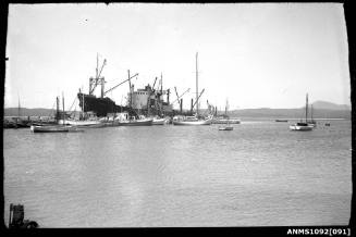 A jetty with cargo ship KAPONGA moored along one side